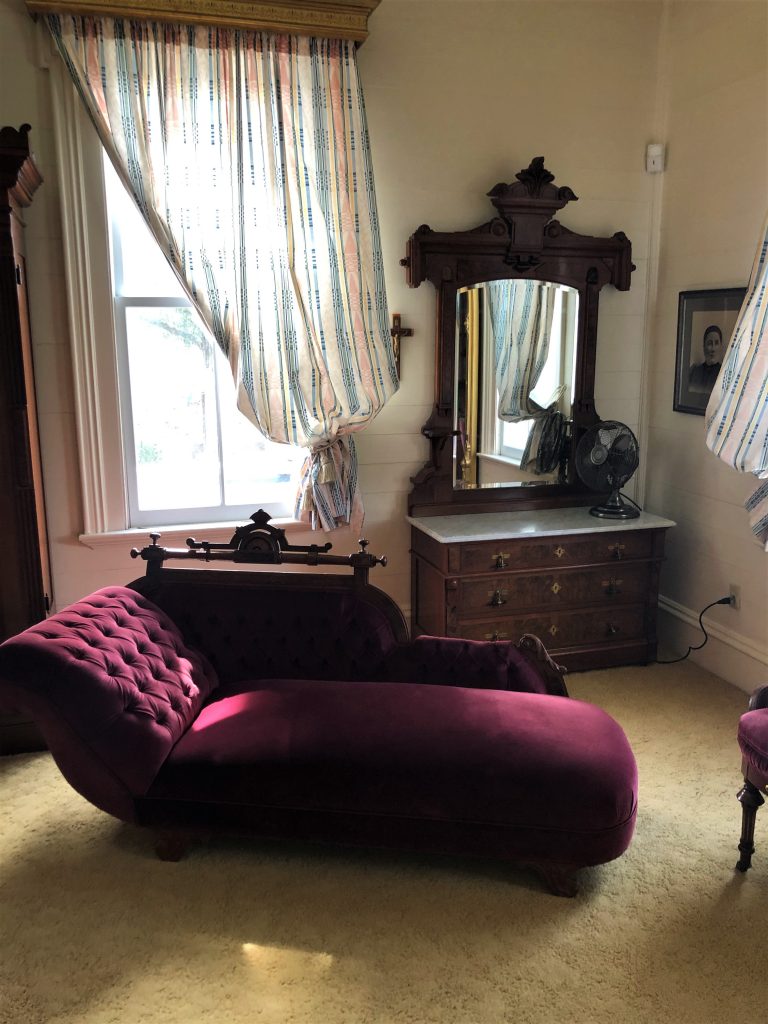 Abele Farms, Yolo County, Woodland, CA. Inside the front bedroom with antique furnishings.