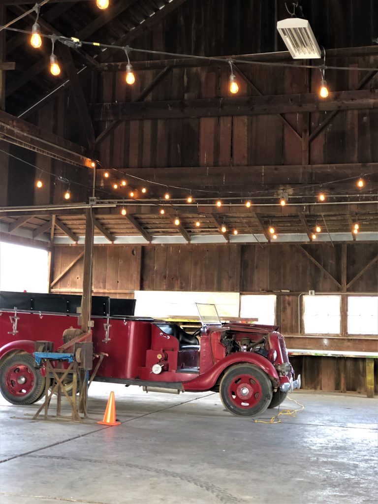 Abele Farms, Yolo County. Inside the reception barn. Vintage firetruck displayed.