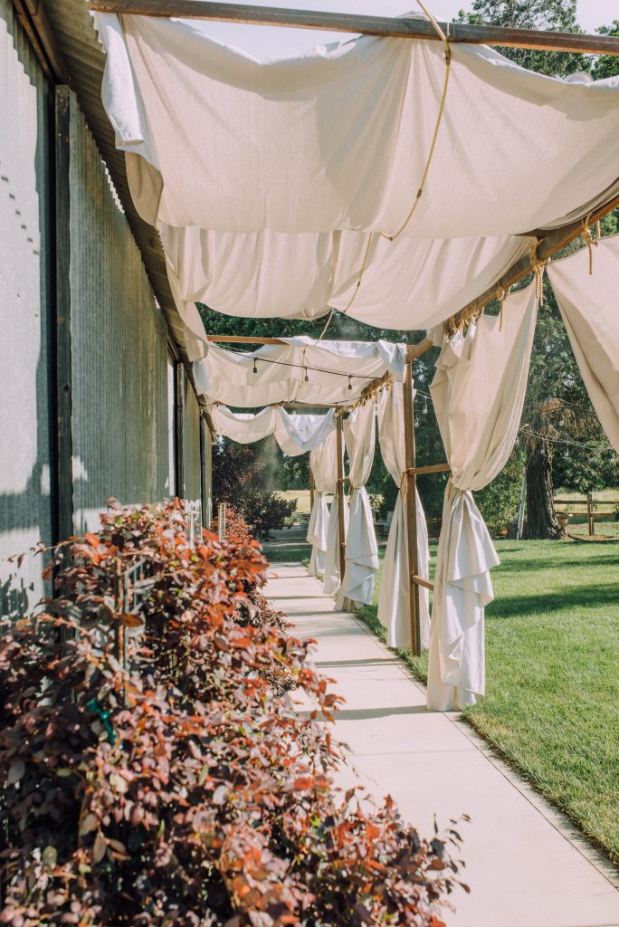 The Barn at Second Wind, Sacramento River Road, Country Farmland. Side of barn with shade curtains and misters.